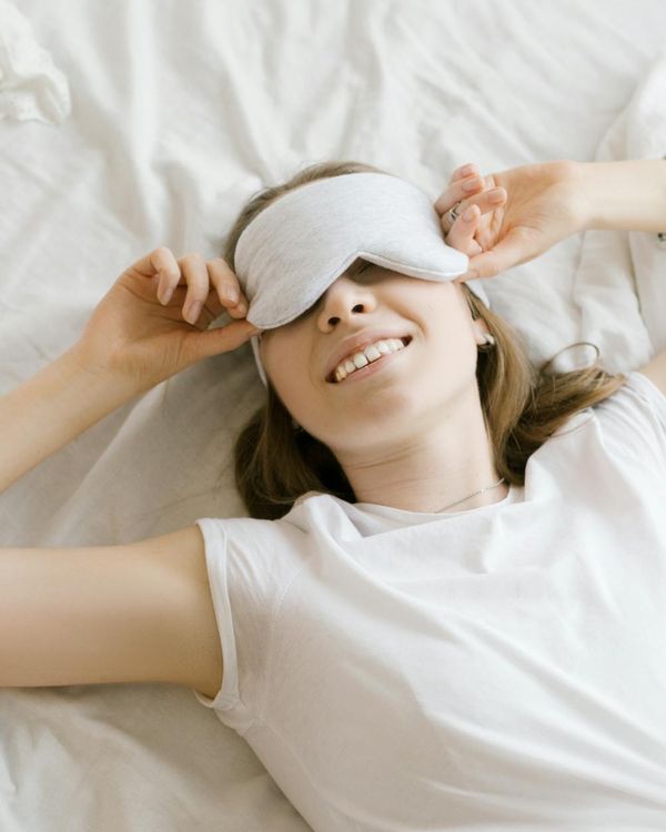 Woman feeling energetic and happy during a light workout at home.